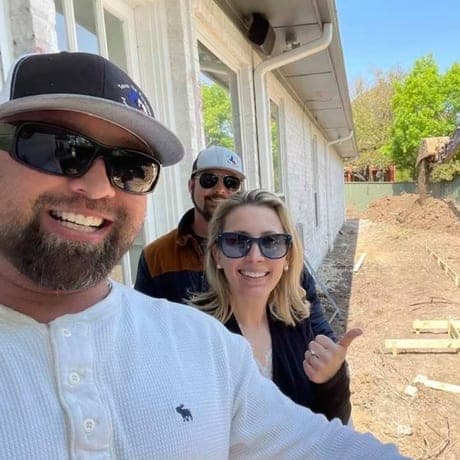 Brandon with clients at their house during the layout stage of a build