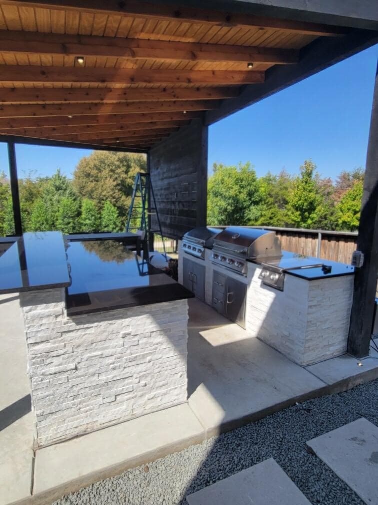 Outdoor kitchen under cedar pergola